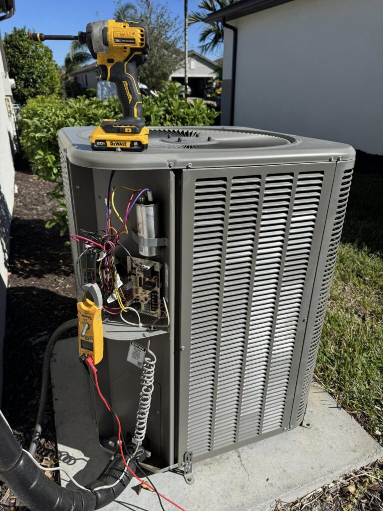 Air Conditioning unit in Port Charlotte, Florida being maintained and checked by Phillips Family A/C