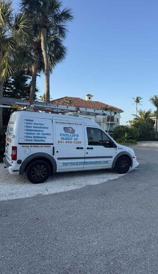 Ford Transit work van parked outside a HVAC customer house after replacement of his A/C unit down in Boca Grande